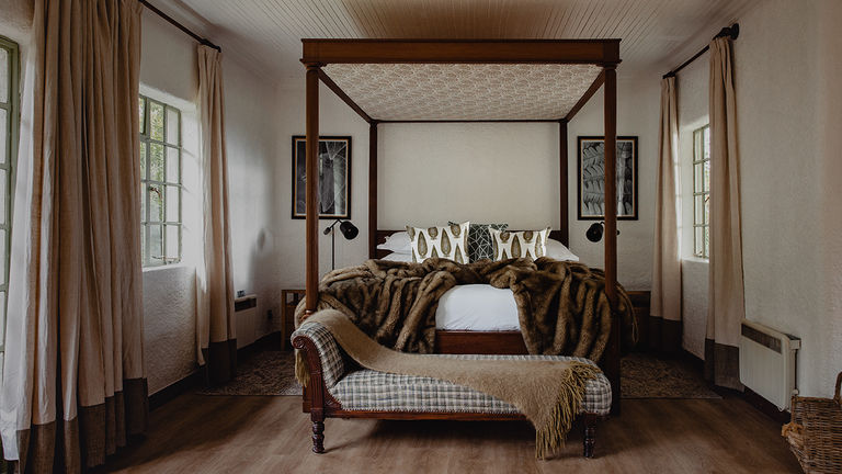 Cottage accommodations feature four-poster beds.