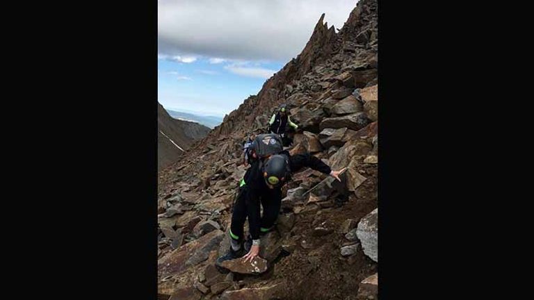 Hiking Wilson Peak requires some scrambling over loose rocks. // © 2017 Meg Spenchian