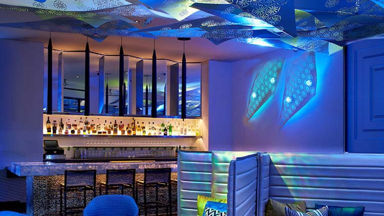 Lighting in the Living Room Bar transitions from warm to cool as day fades into night. // © 2016 W Hotels