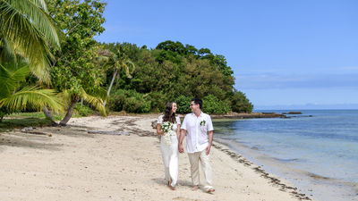 Lomani Island Resort's secluded stretch of white-sand beach makes a picturesque backdrop for weddings and elopements.