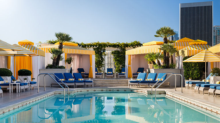 Rooftop cabanas feature the hotel’s iconic yellow and white stripes.